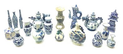 A small Chinese blue and white moon flask, with twin handles, the body decorated with a dragon chas