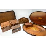 Three wooden trays, to include an oval mahogany example with inlaid shell detail to centre and two