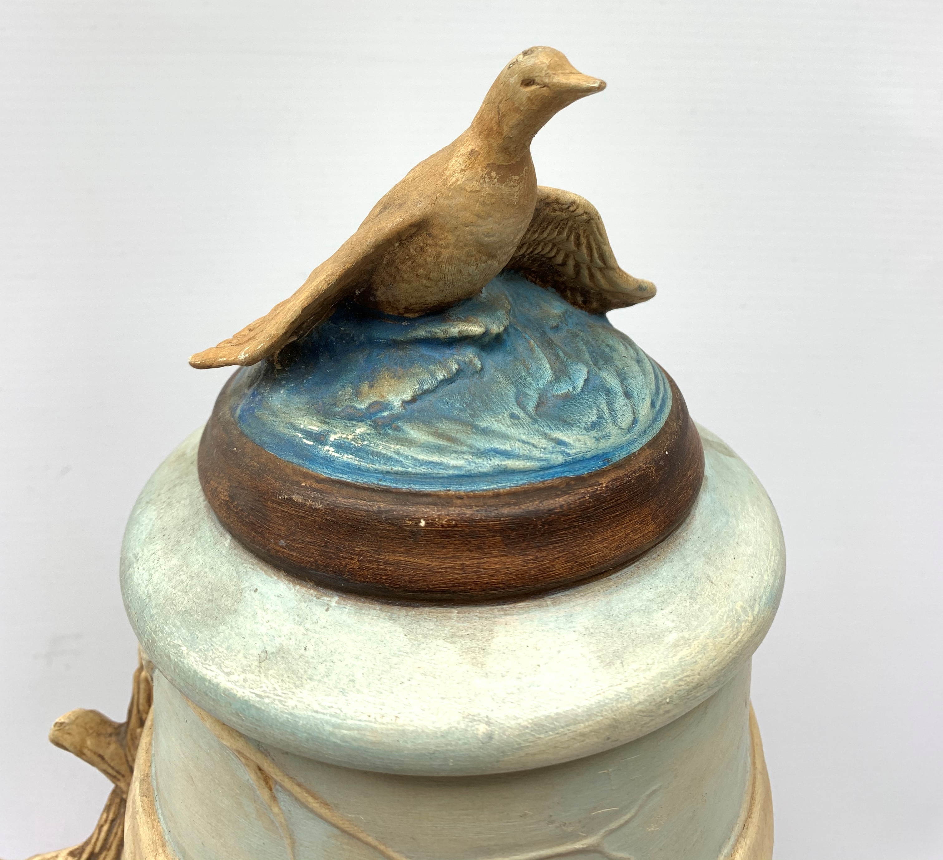 A large earthenware stein, decorated with a moulded continuous band of game birds, with confirming - Image 2 of 3