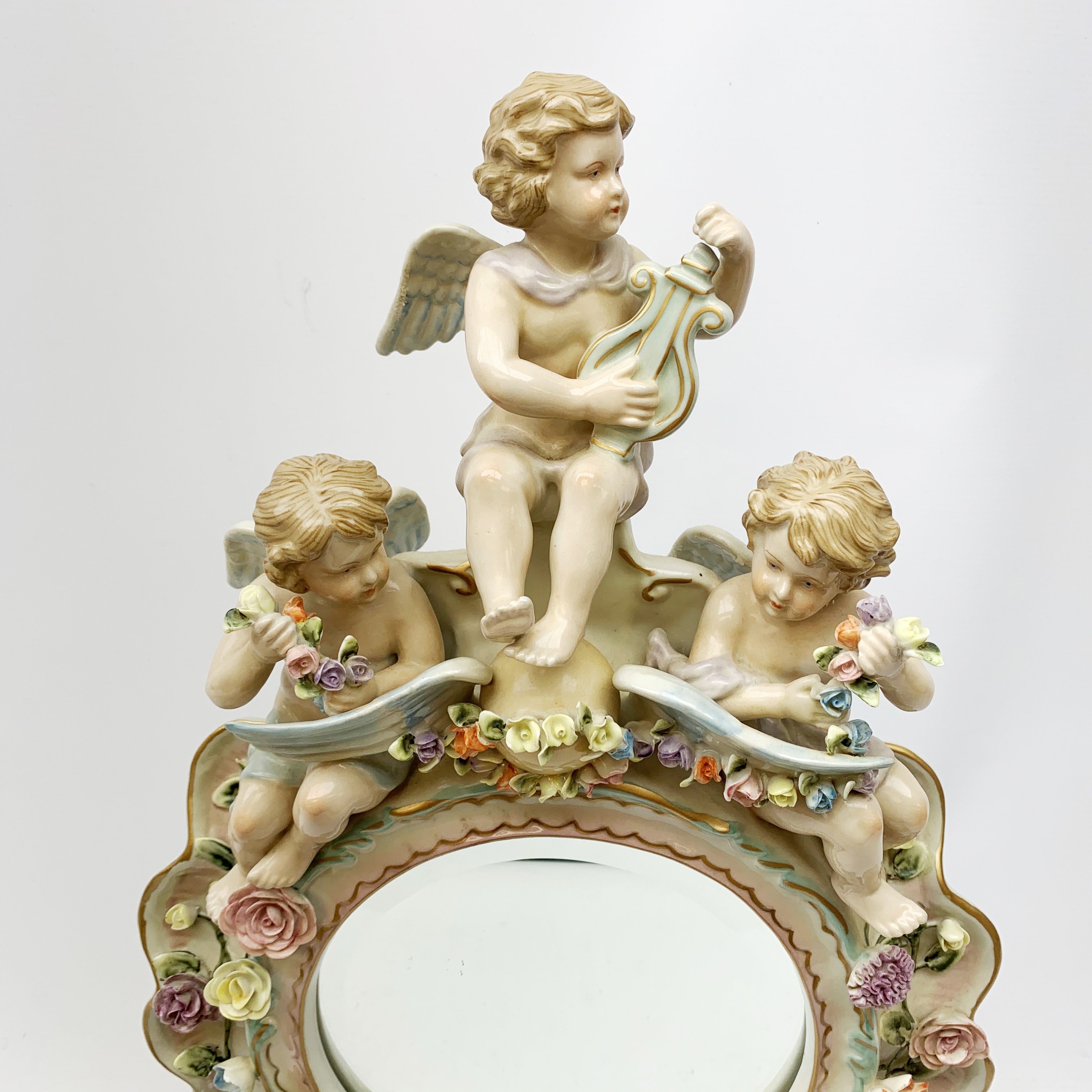 A late 19th century Sitzendorf porcelain mirror, the mirror plate of circular form set within a sha - Image 2 of 13