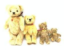 A group of four teddy bears, to include a small Steiff example with button to ear, and a Chad Valle