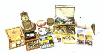 A group of clock and watch parts for repairs, to include various watch dials, clock hands, etc.