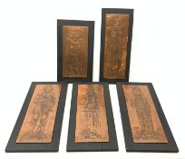 Five embossed copper plaques of rectangular form decorated with medieval knights, mounted upon ebons