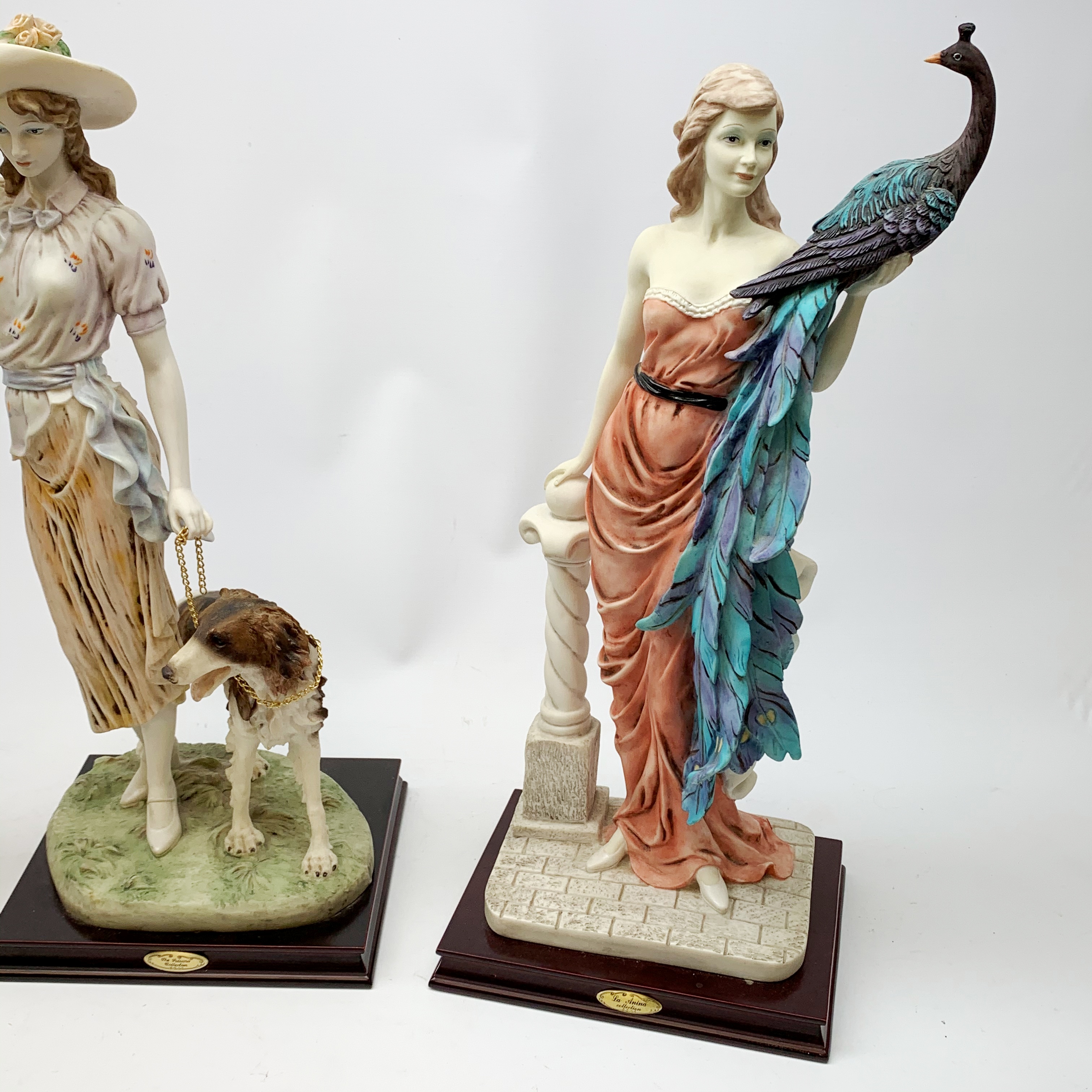 A pair of La Anina Collection figurines, each modelled as a female figure in pink dress supporting - Image 3 of 3