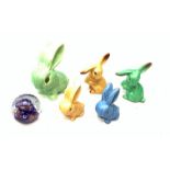 Five Sylvac Rabbits, to include a large example marked 1026, etc., together with a Caithness glass