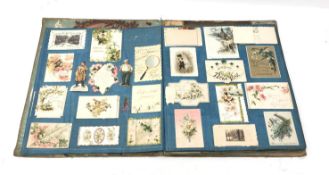 Victorian scrap book containing twenty linen covered leaves fully stocked with Victorian and early