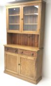 Victorian pitch pine dresser, two glazed doors enclosing fitted shelves, above two drawers and two