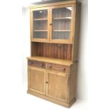 Victorian pitch pine dresser, two glazed doors enclosing fitted shelves, above two drawers and two