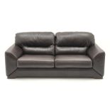 Three seat sofa upholstered in brown leather (W210cm) a pair matching armchairs (W110cm) and footst