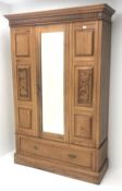 Late Victorian satin walnut wardrobe, projecting cornice, single mirrored door above drawer, plinth