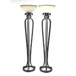 Pair of black painted metal floor standing uplighter lamps, each of skeletal form with three cluster