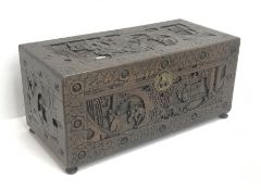 Eastern carved camphor wood blanket box depicting urban scene, W94cm, H49cm, D45cm