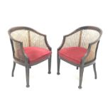 Pair Early 20th century Georgian style mahogany bergere armchairs, square tapering supports carved w
