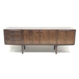 AH McIntosh - 1970s rosewood sideboard fitted with three drawers, double cupboard and fall front com