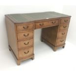 Mid 20th century walnut twin pedestal desk, three piece inset leather top, nine drawers, shaped pli