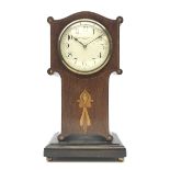 Art Nouveau inlaid mahogany serpentine top mantel timepiece, the convex white enamel Arabic dial si