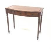 Chinese rosewood serpentine front side table, three drawers, turned tapering fluted supports, W92cm