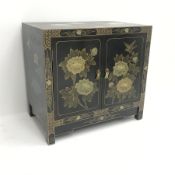Chinese black lacquered side cabinet, floral pattern, two doors enclosing single shelf, W66cm, H61c
