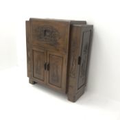 Eastern carved rosewood cocktail cabinet, double hinged lid enclosing mirrored back, four cupboard