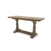 'Mouseman' adzed Yorkshire oak coffee table, rectangular top raised on octagonal supports with sledg