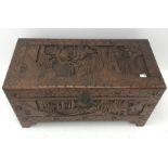 Eastern carved camphor wood blanket box depicting harbour scene, W95cm, H49cm, D46cm