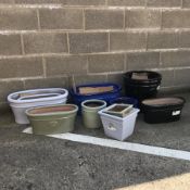 A quantity of approx. sixteen glazed ceramic planters - various shapes and sizes