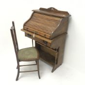 Early 20th Century tambour roll top desk enclosing fitted interior above single drawer, shaped soli