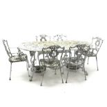 Ornate cast alloy garden table decorated with scrolls and foliage (186cm x 95cm, H72cm), and set si