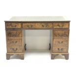 Late 20th century elm twin pedestal desk, rectangular moulded top with green leather inset, fitted w
