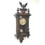 Late 19th century walnut cased Vienna style wall clock, with eagle and final pediment, twin train '