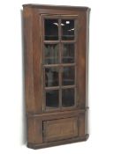 19th century stained pine barrel back corner cupboard, moulded cornice, astragal glazed door enclosi