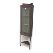 Edwardian inlaid mahogany corner display cabinet, raised shaped back, single glazed doors enclosing