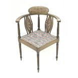 Edwardian mahogany corner chair, cane panelled back with reeded supports, upholstered seat, W59cm