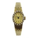 9ct gold bracelet wristwatch with diamond set bezel, London import marks 1979