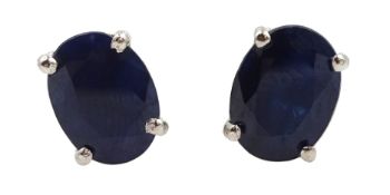 Pair of silver oval sapphire stud earrings, stamped 925