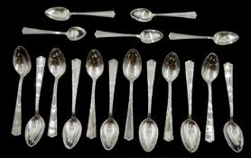 Set of twelve silver teaspoons and five matching silver coffee spoons, all stamped M.B.Co Sterling,