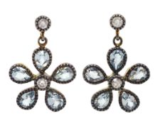 Pair of blue topaz and diamond, daisy design pendant earrings