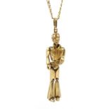 Gold Elvis Presley pendant, on gold flattened curb chain, both hallmarked 9ct