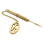 Gold engine turned toothpick hallmarked 9ct, with gold 'TR' fob and chain stamped 9ct