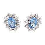 Pair of 18ct white gold aquamarine and diamond cluster stud earrings, hallmarked, aquamarine total w