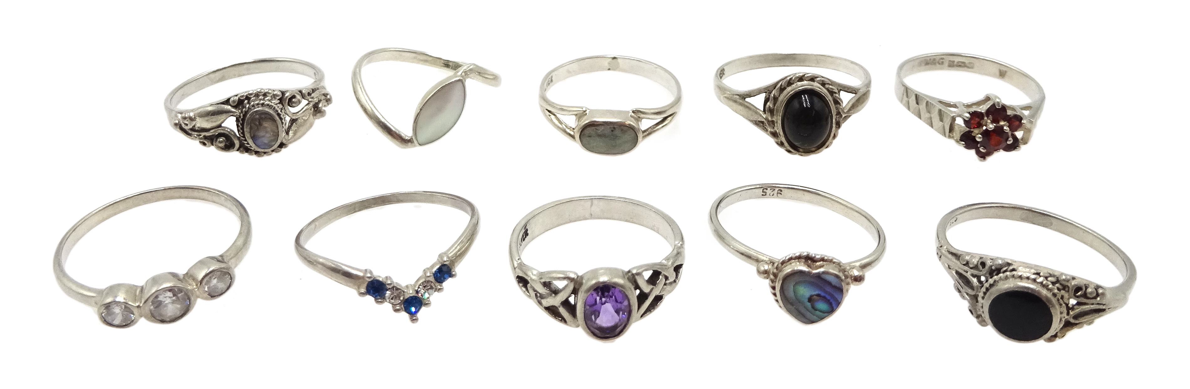 Ten silver stone set rings, including amethyst, cubic zirconia and garnet, all stamped (one tested)