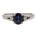 18ct white gold three stone oval sapphire and round brilliant cut diamond ring, stamped 750
