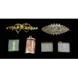 Two gold money box charms, gold brooch all 9ct, silver brooch and two silver charms, all stamped or