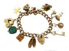 9ct gold curb bracelet with heart locket hallmarked, with ten 9ct gold charms including stork carry