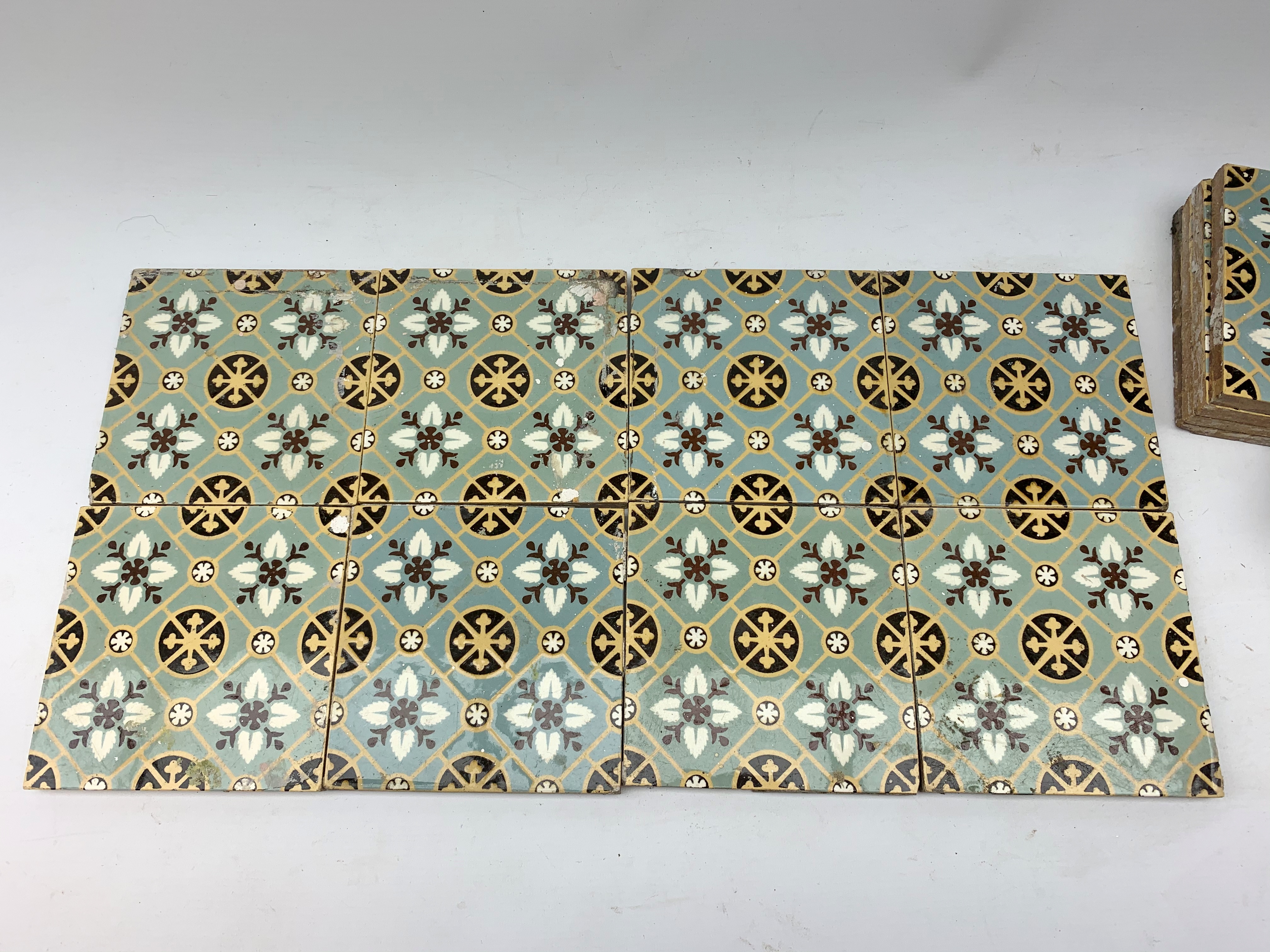 Twenty four Victorian tiles, each decorated with a stylised foliate grid pattern upon a light blue g - Image 2 of 2