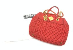A Moschino red quilted handbag, with gold coloured hardware, L37cm.