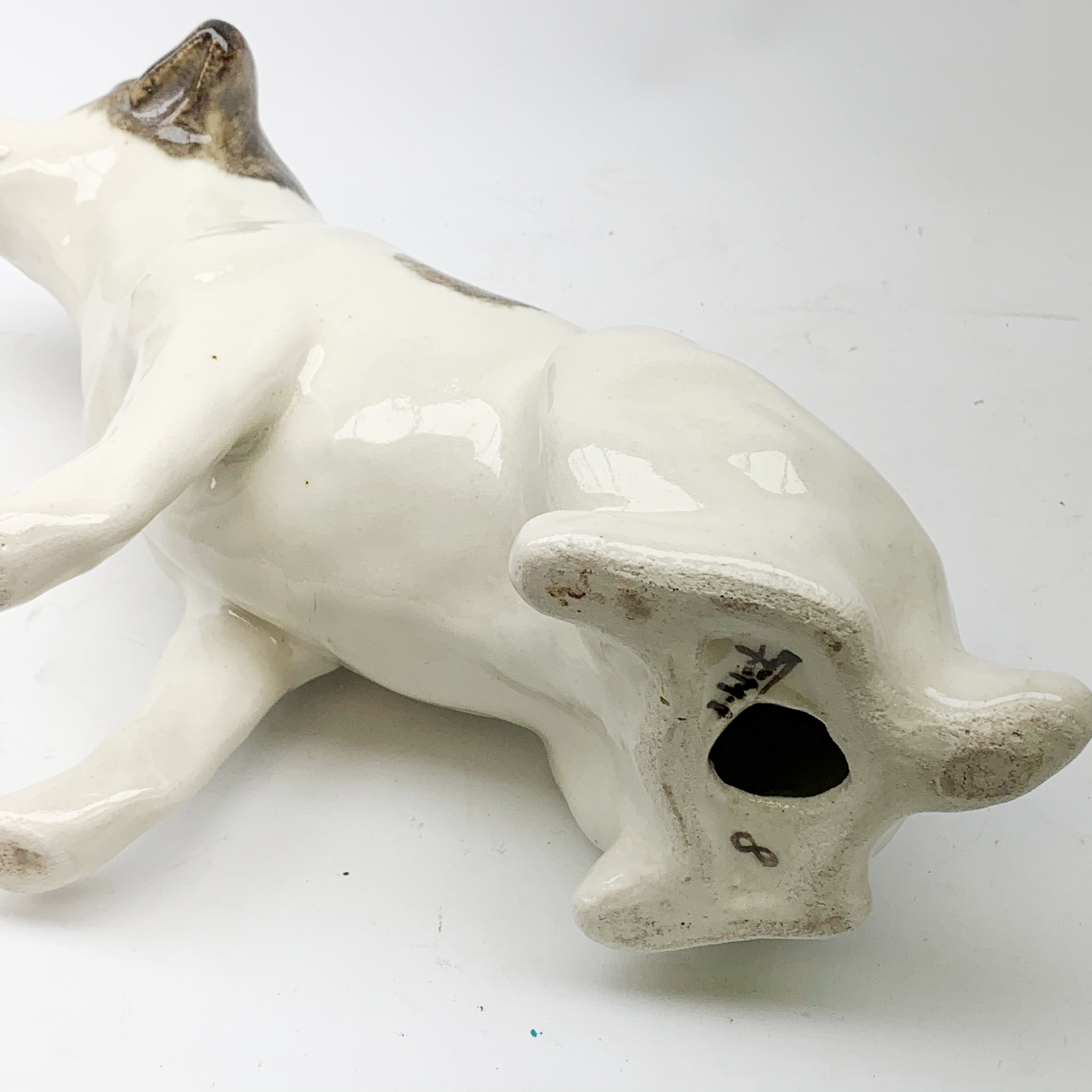 A Winstanley pottery figure modelled as a terrier dog, with inset glass eyes, marked beneath, H28cm, - Image 2 of 3