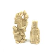 A Japanese carved ivory okimono, modelled as a flower seller with attendant, H16cm, together with a