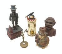 Four cast iron novelty money boxes, largest H28cm, together with a car mascot modelled as a female f