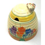 A Clarice Cliff Bizarre honey pot, of domed form with bee finial to the removable cover, decorated i